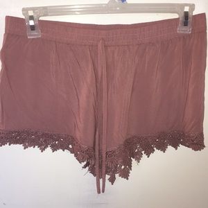 Deep pink shorts with flowered pattern